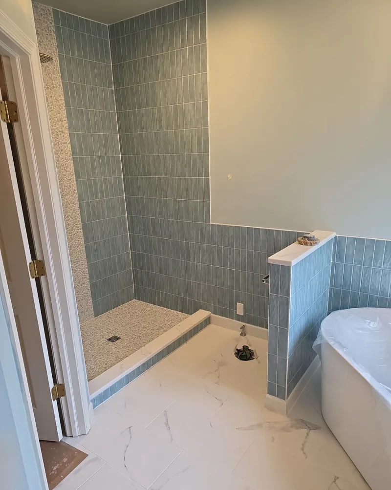 Green: blue-green vertical tile in a shower and on a half wall.